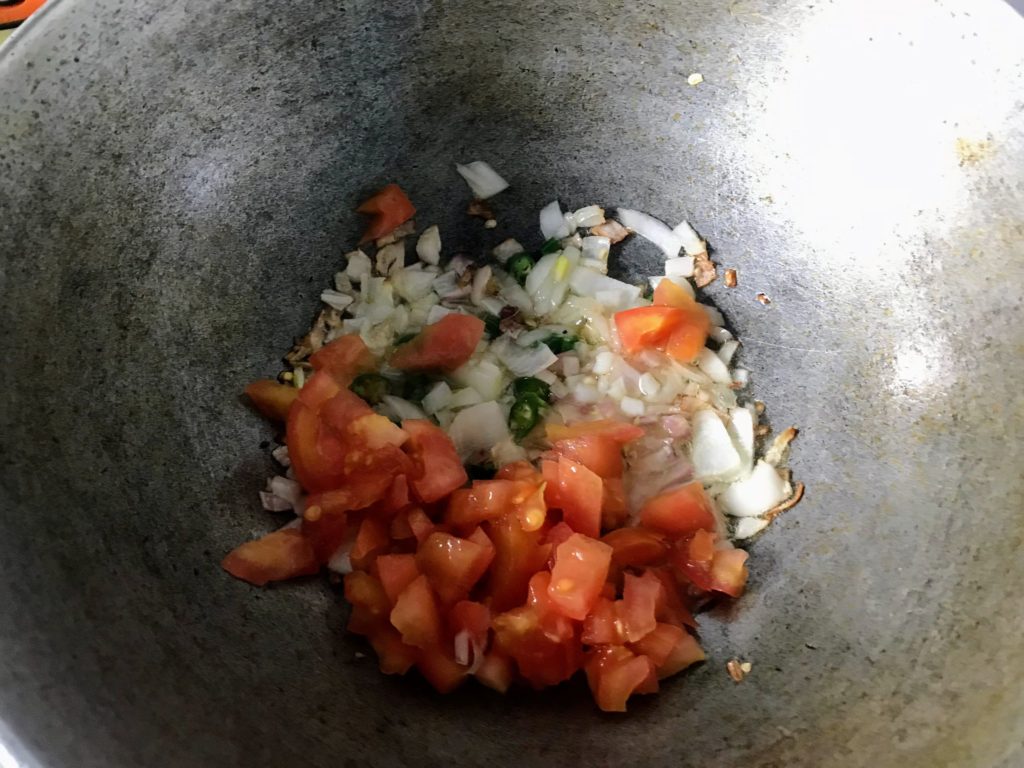 Fry tomato with onion