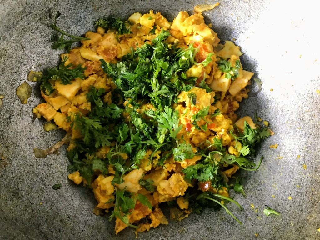 Coriander leaves on 'Boiled Egg Bhurji.