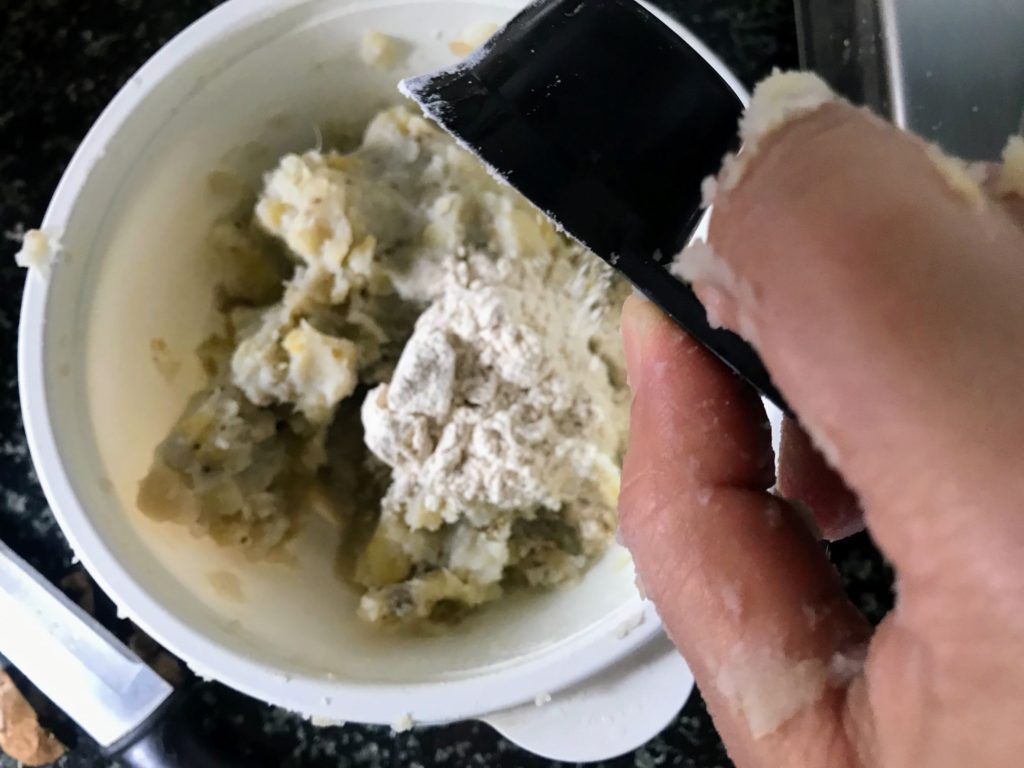 Adding flour to mashed vegetables