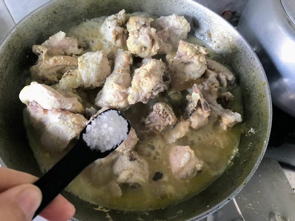 Adding salt to make chicken curry