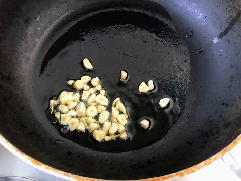 Sautéing chopped garlic