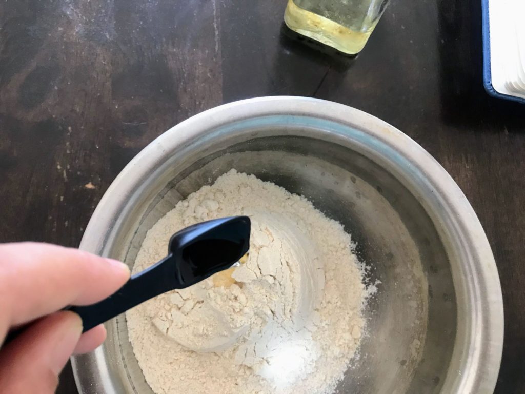 Adding oil on flour
