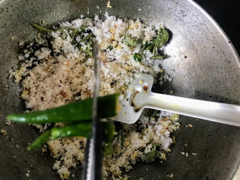 Green chillies on grated coconut
