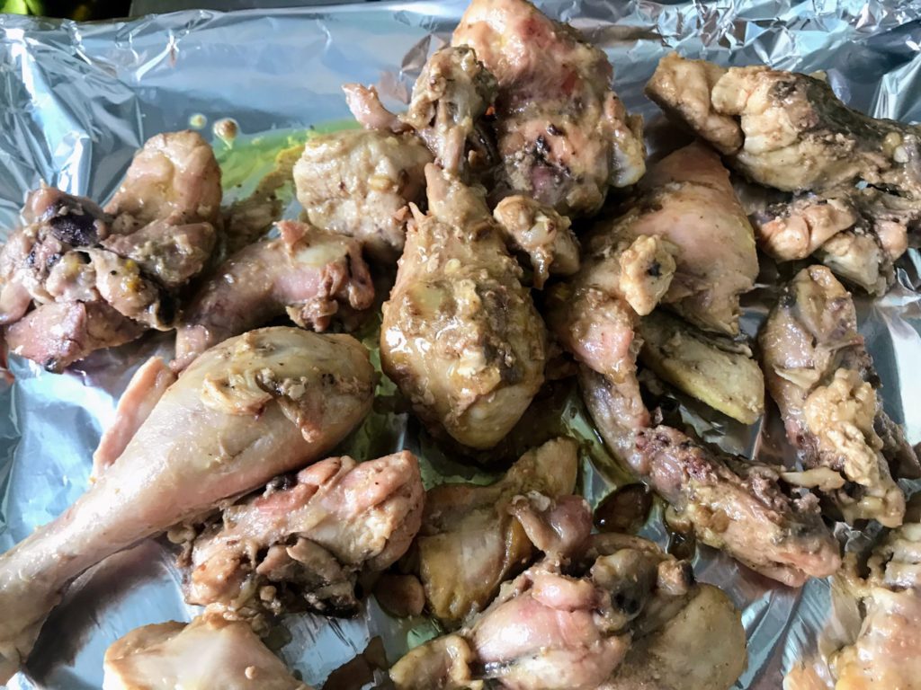 Chicken pieces spread on tray