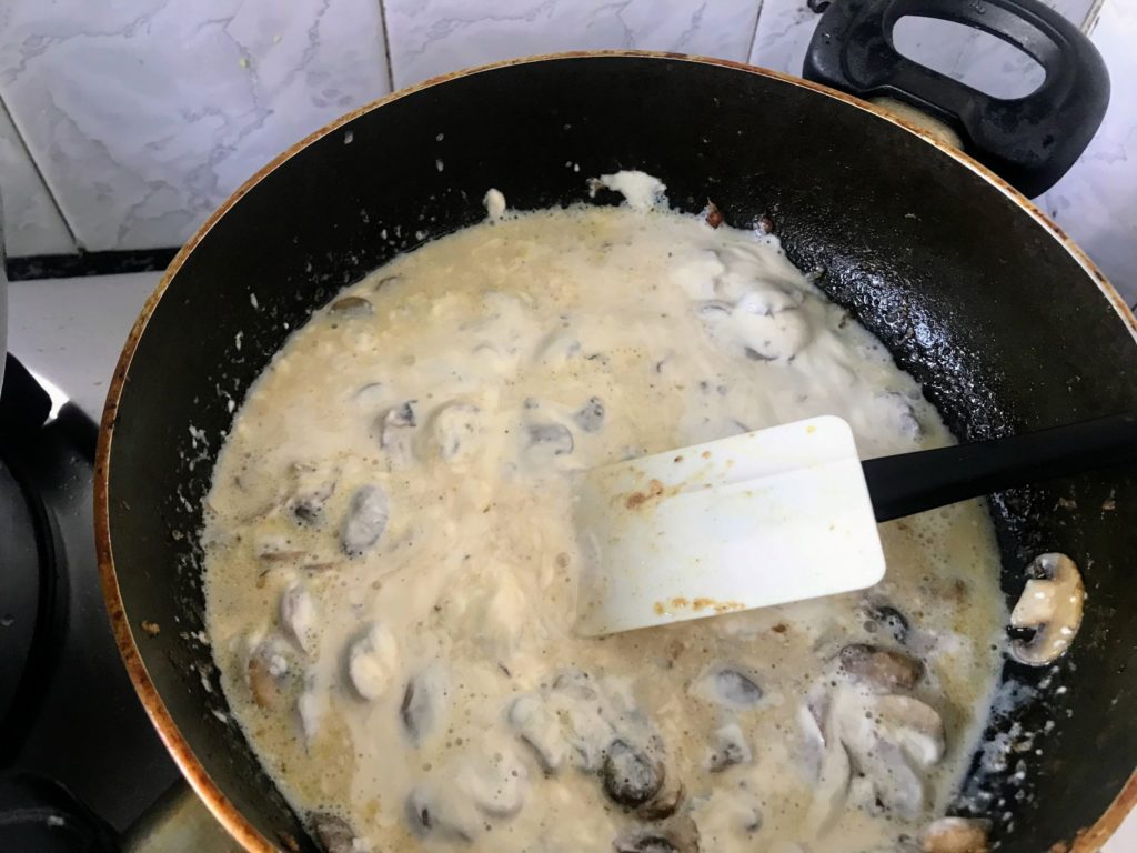Cooking mushroom in white sauce