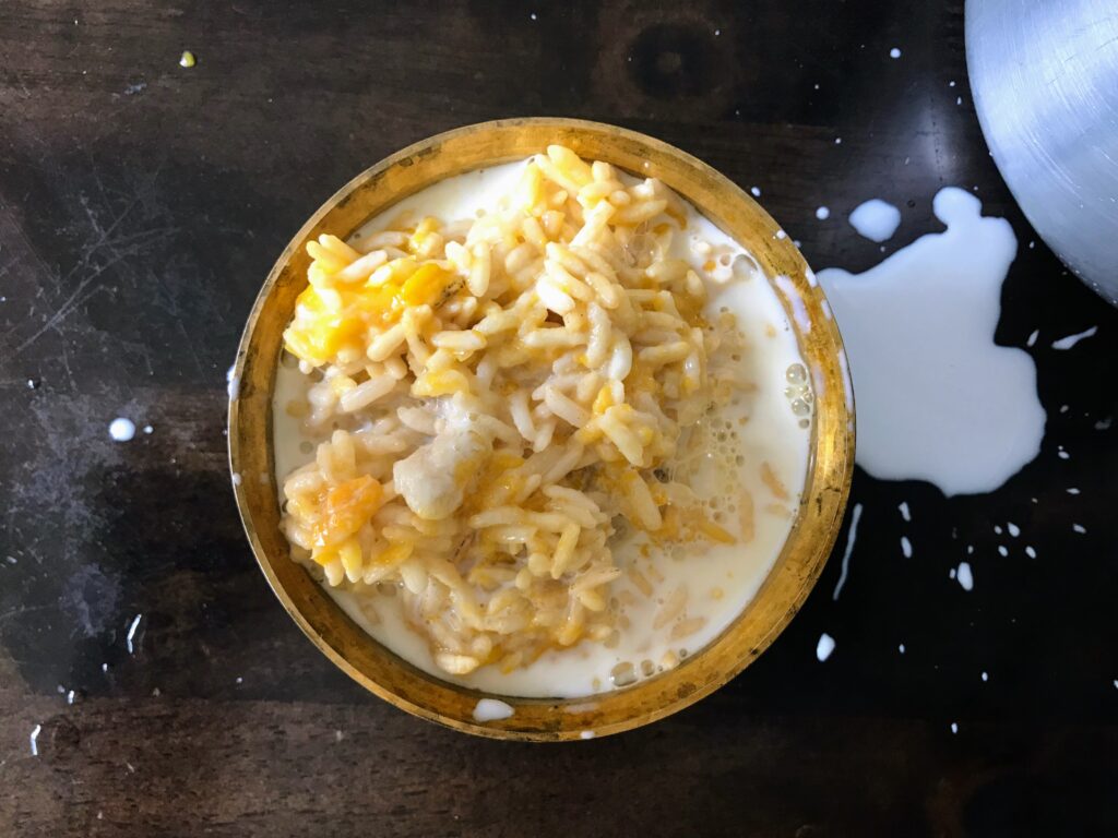 Milk on puffed rice with mango and banana