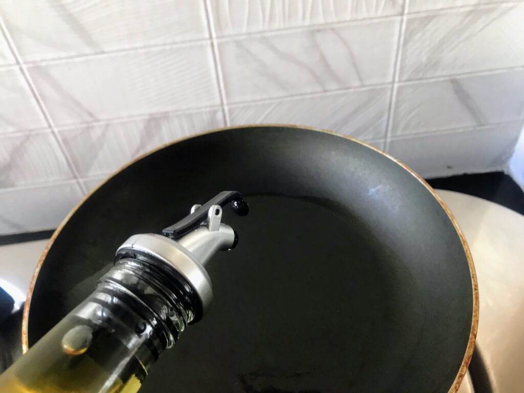 Pouring oil in a pan