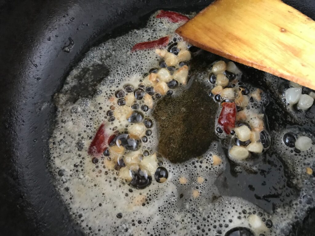 Sautéing garlic and red chilli in butter