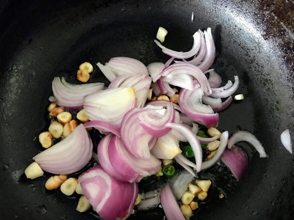 Frying sliced onion